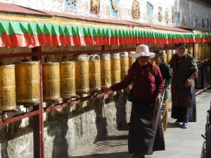 Locals spinning prayer wheels in Lhasa
